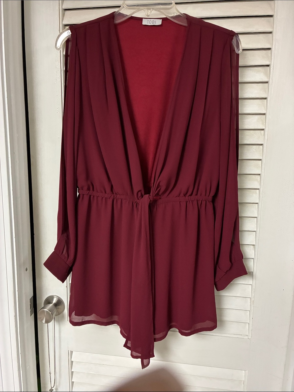 Tobi Burgundy Peek-a Boo Long-Sleeve V-Neck Burgundy Romper. Fully lined.